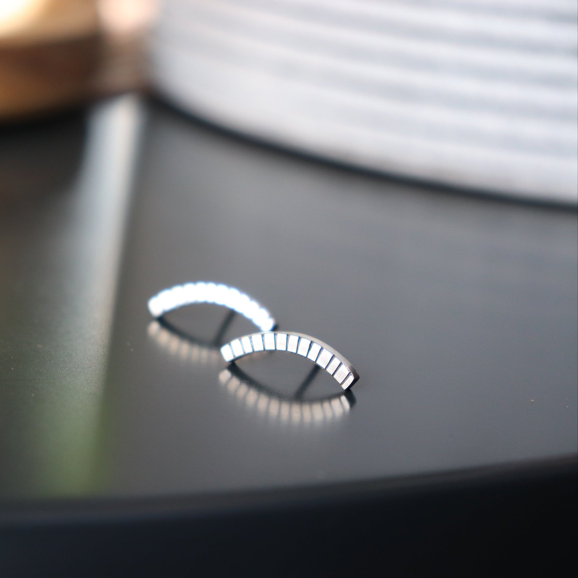 Handcrafted minimalist silver stud earrings from the "Nothing, Really" collection. Made from recycled silver with clean lines and a high-shine finish. Ships from Croatia.