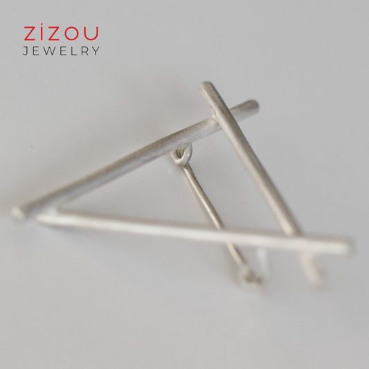 Triangle brooch