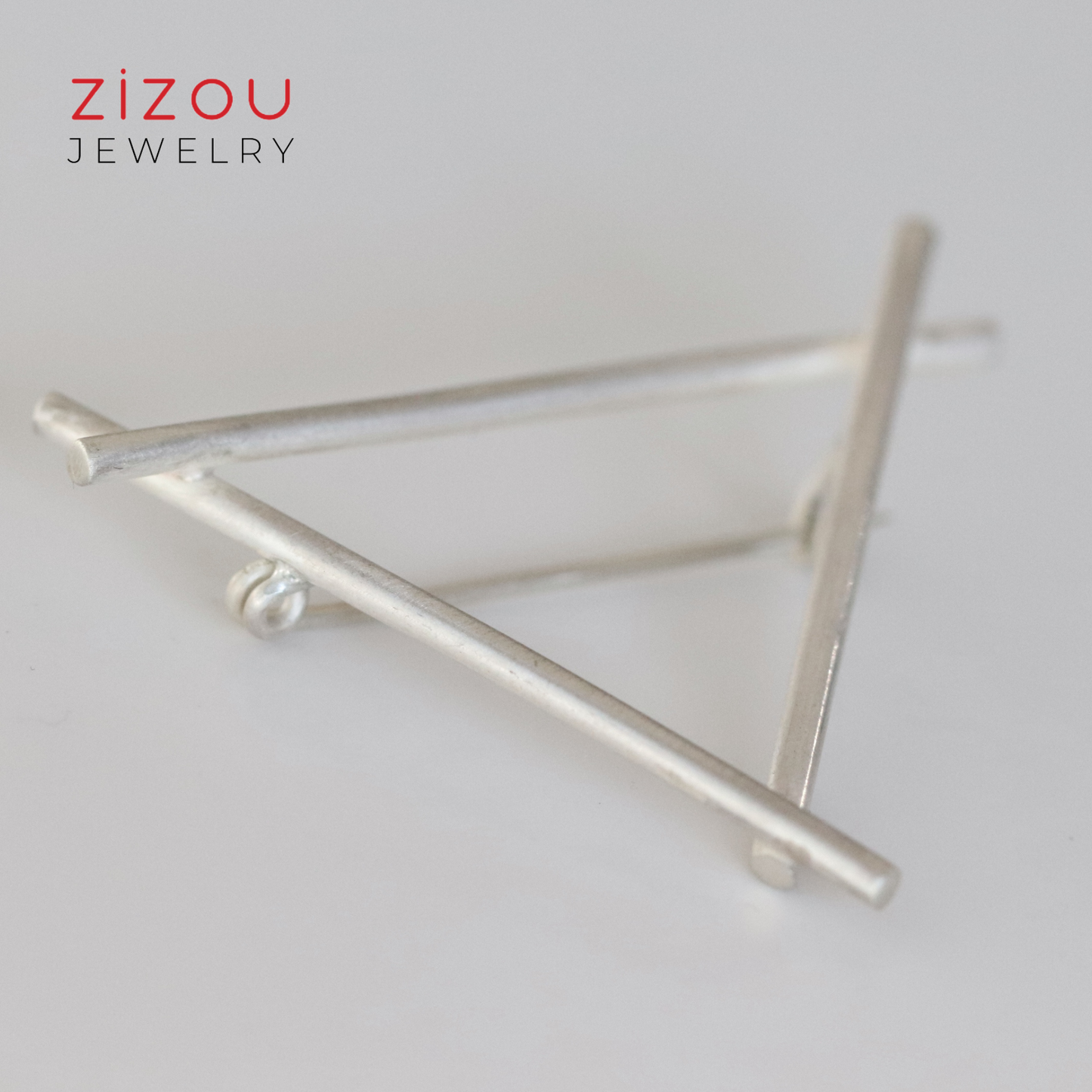 Triangle brooch
