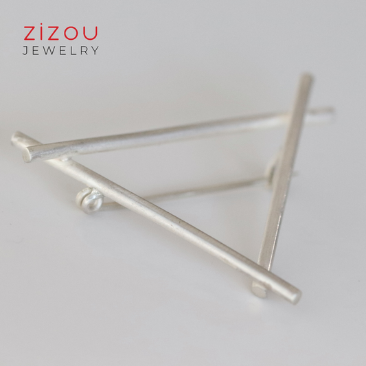Triangle brooch