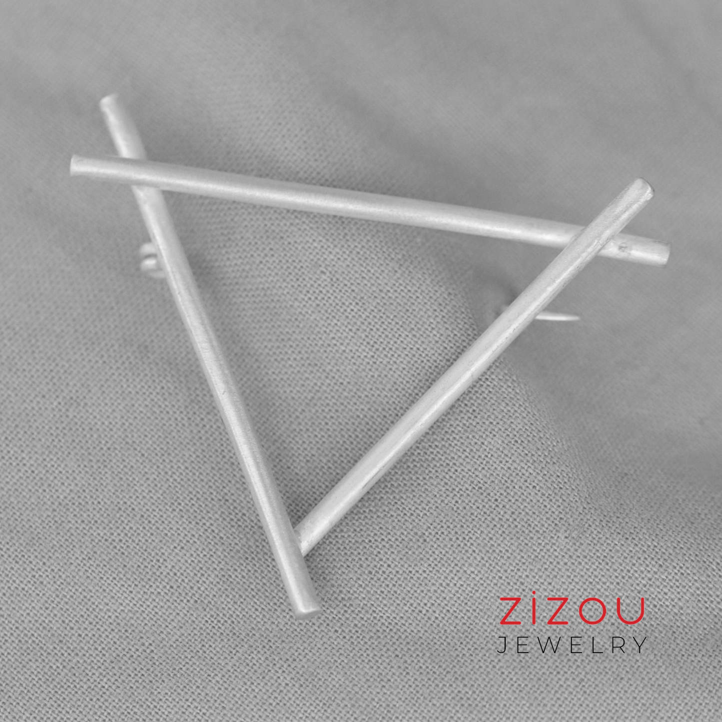 Triangle brooch